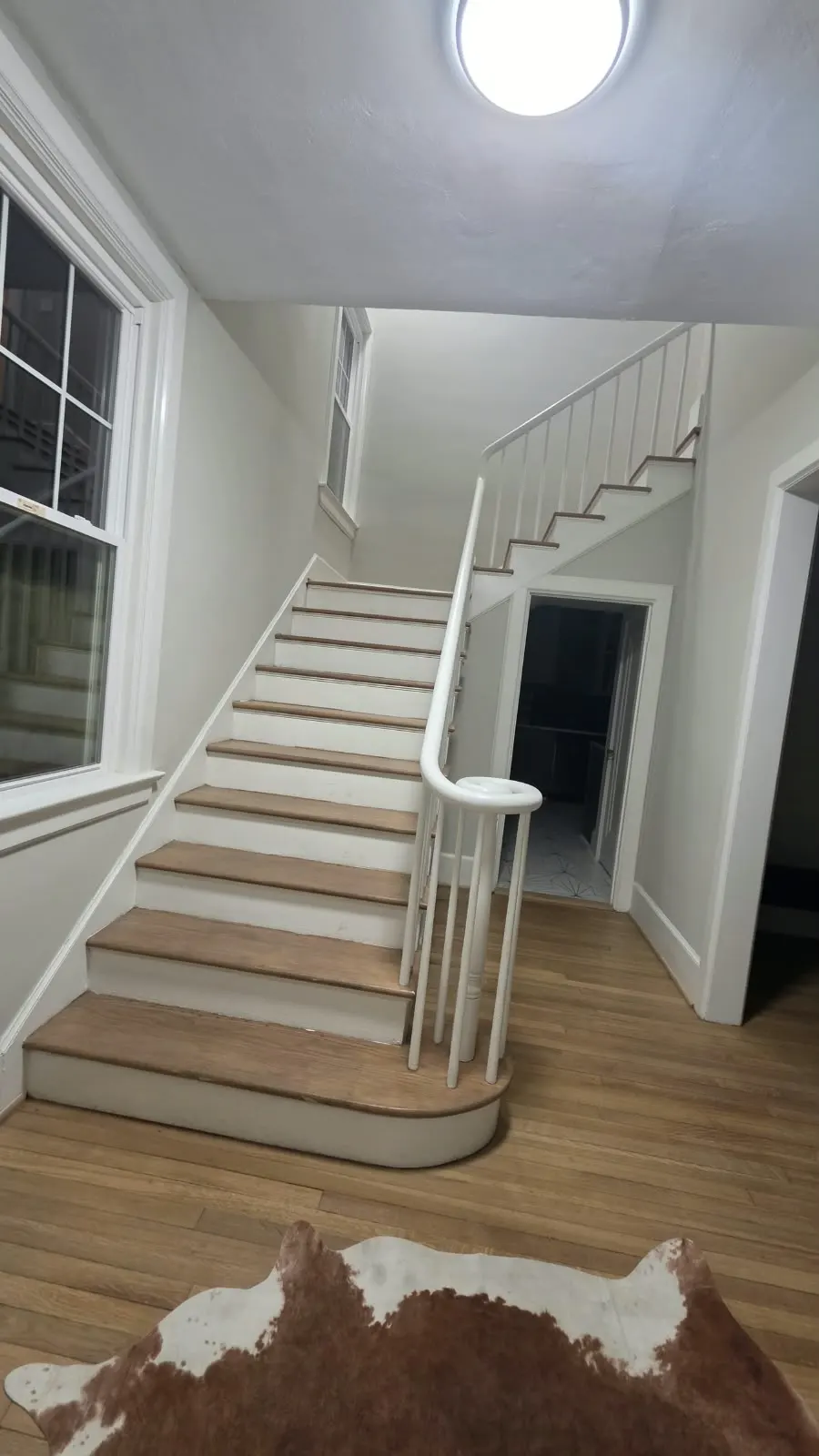 Hardwood floor and staircase at the base of new stair treads, flooring in Hampton, VA