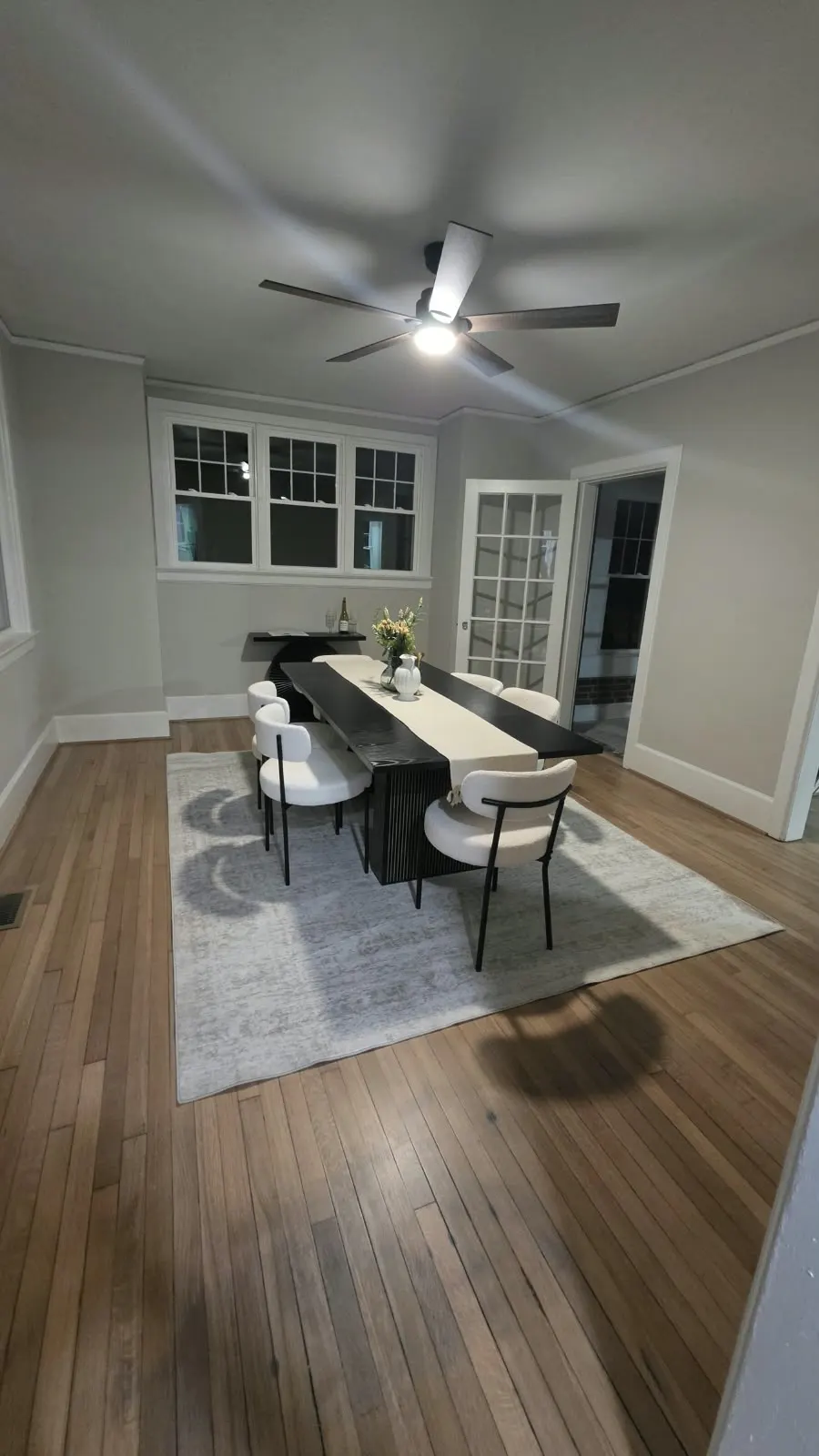 Dining room with hardwood floors and fresh gray walls in Hampton, VA