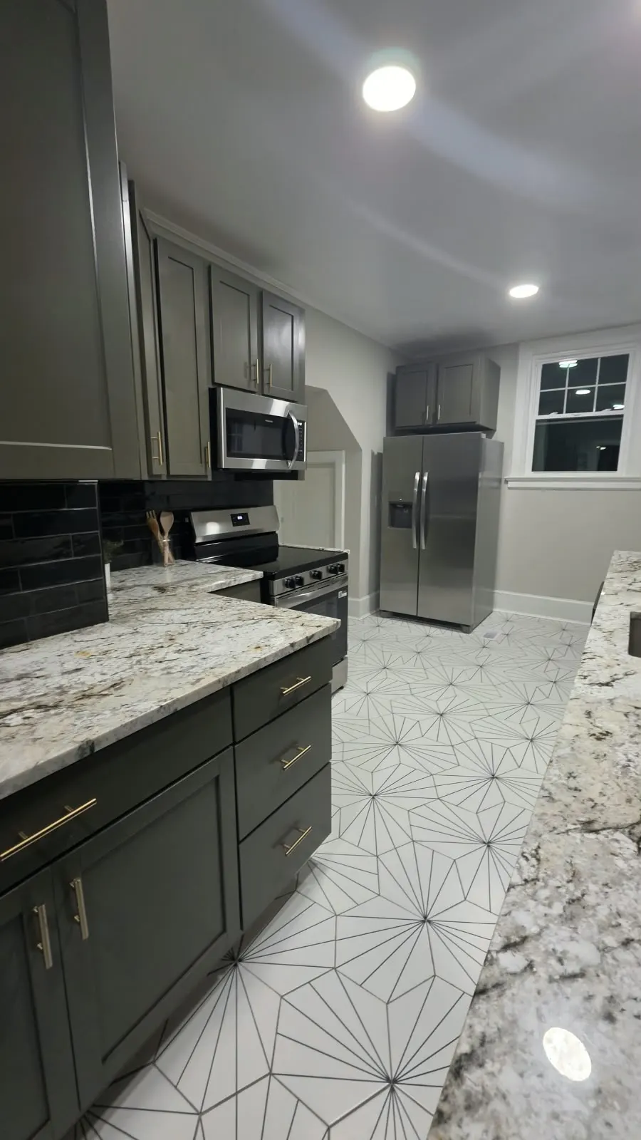Kitchen with dark cabinets, granite counters and star-pattern tile floor in Hampton, VA