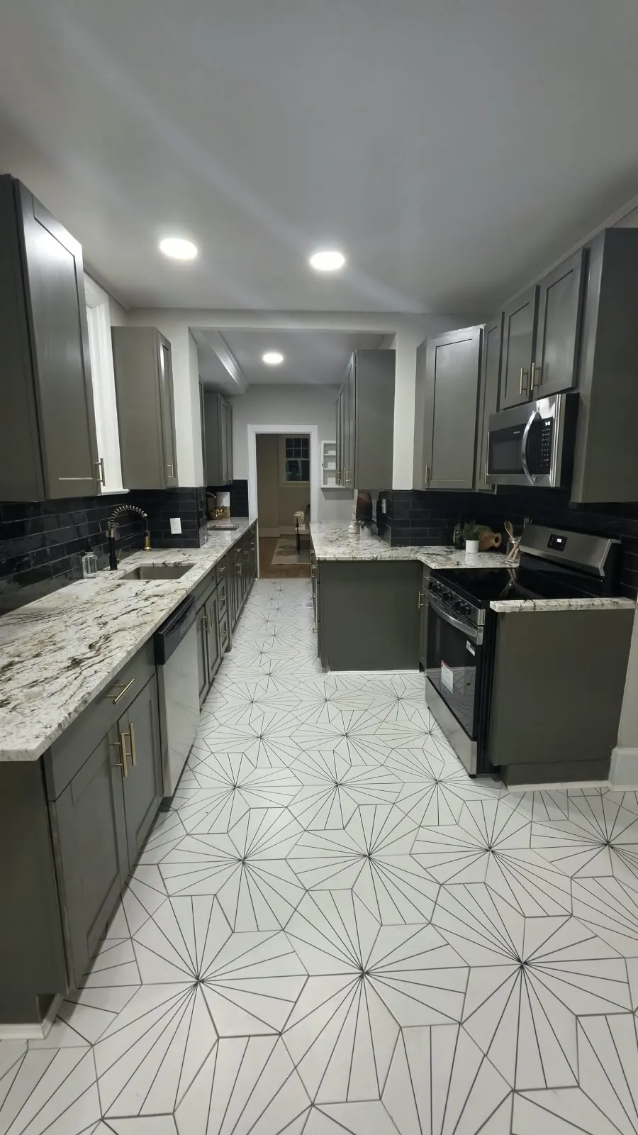 Long galley kitchen with recessed lighting and granite counters in Hampton, VA