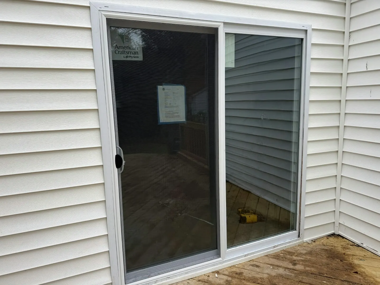 New sliding door set into a vinyl-sided wall in Hampton, VA