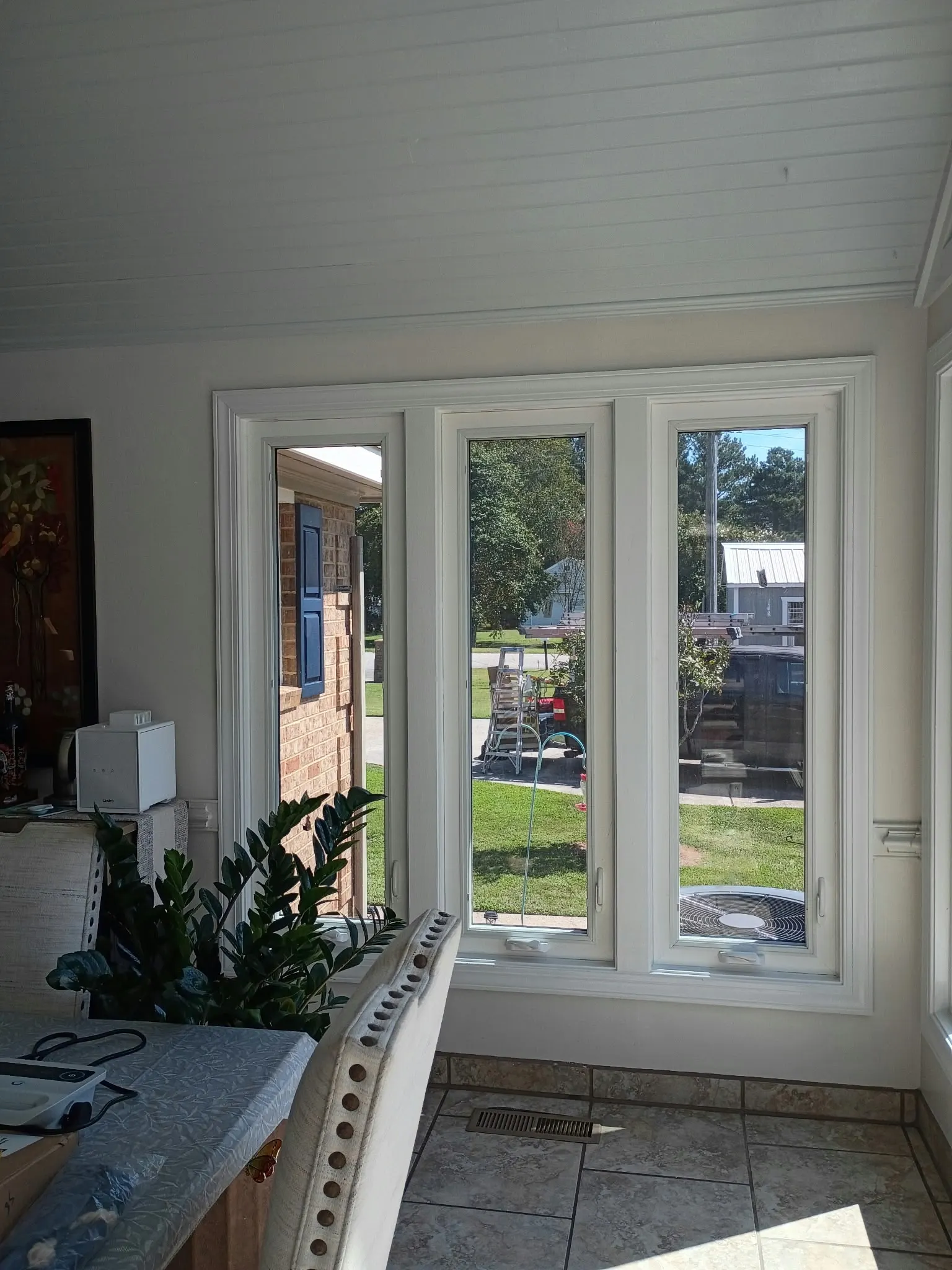 Interior view of tall new windows in a Hampton, VA sunroom